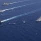 The Theodore Roosevelt Carrier Strike Group cruises in formation