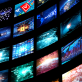 Abstract image of wall of video screens showing news and other media content
