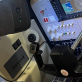 Woman using virtual reality goggles in aircraft cockpit